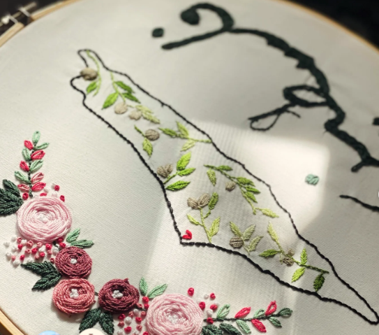 Embroidered map with roses